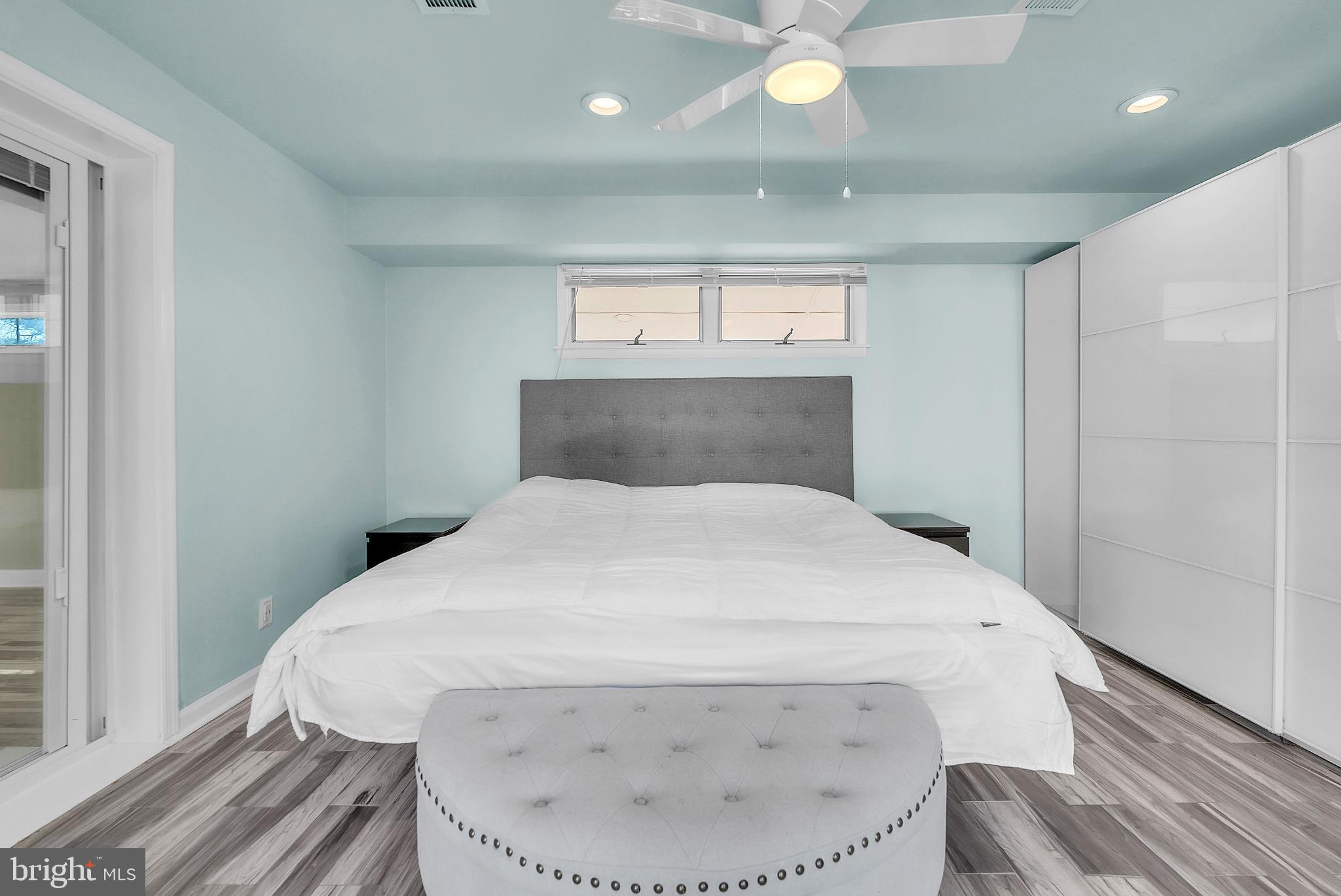 14933 Wellwood Road Silver Spring, MD 20905 - Photo 32 of 50 Serene primary bedroom with calming blue tones.