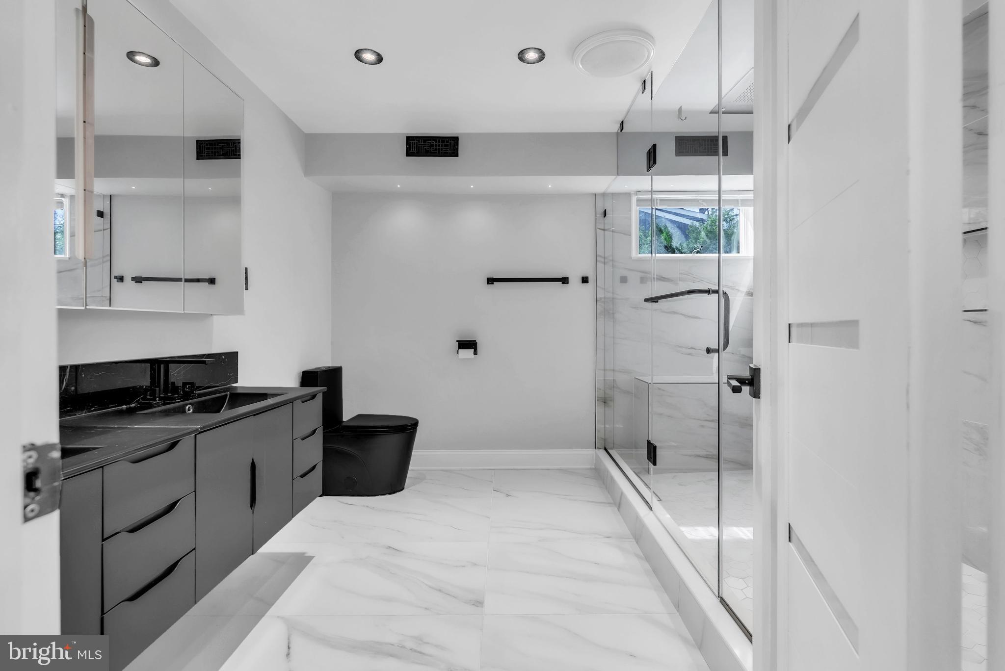 14933 Wellwood Road Silver Spring, MD 20905 - Photo 35 of 50 Sleek modern primary bathroom.