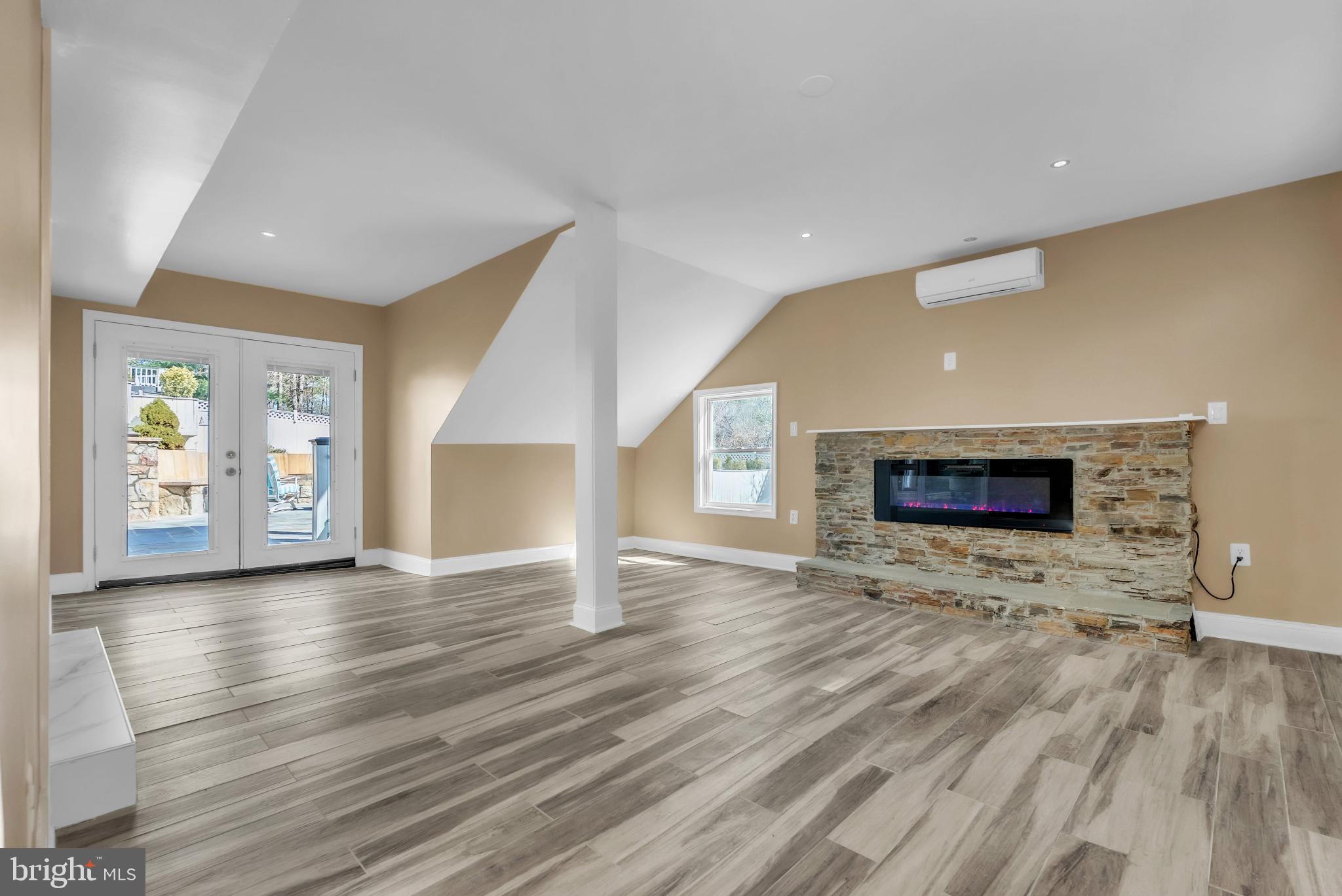 14933 Wellwood Road Silver Spring, MD 20905 - Photo 40 of 50 Bright, airy bonus space with electric fireplace.