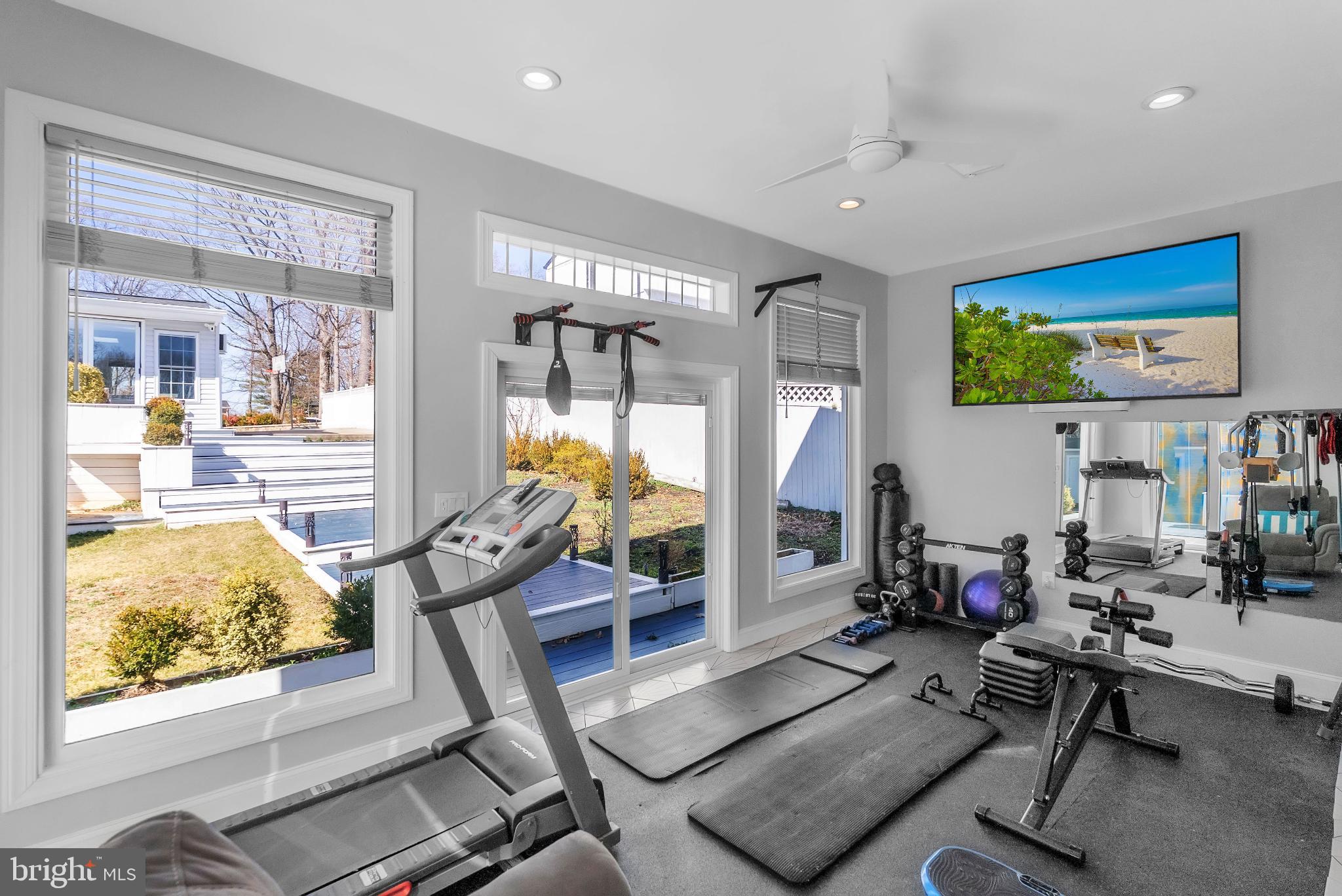 14933 Wellwood Road Silver Spring, MD 20905 - Photo 44 of 50 Bright and airy home gym with scenic views.