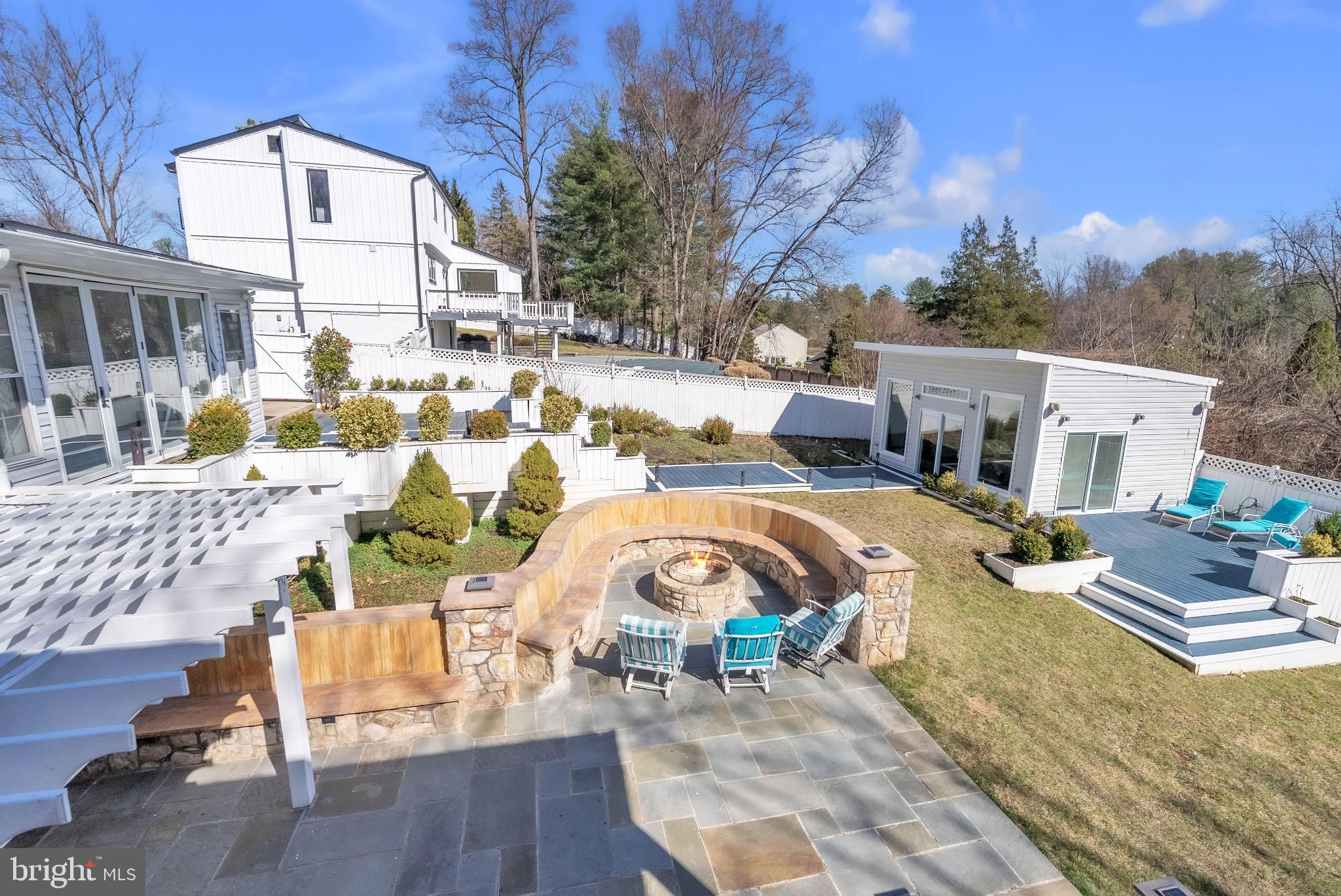 14933 Wellwood Road Silver Spring, MD 20905 - Photo 48 of 50 Serene outdoor oasis with fire pit retreat.