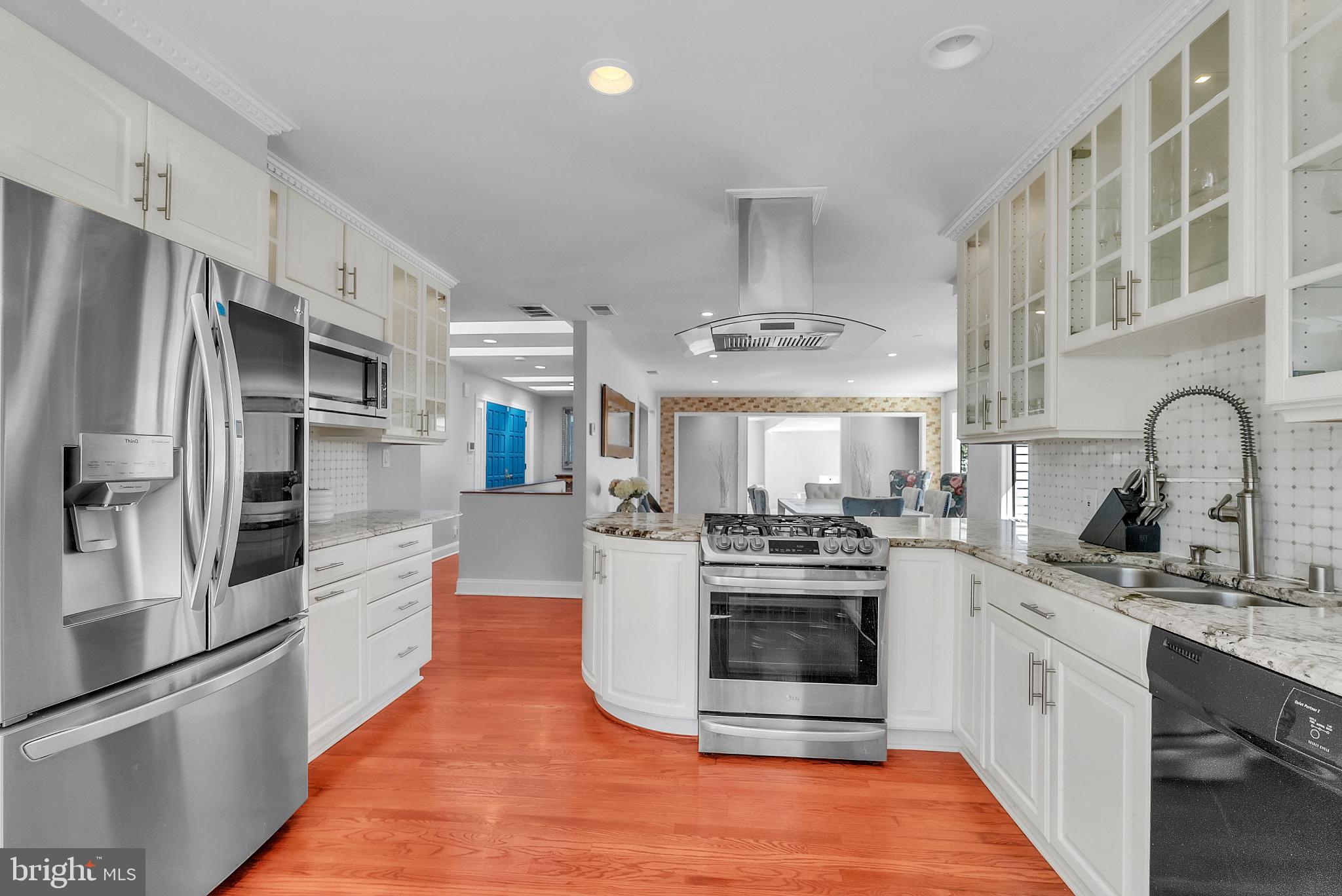 14933 Wellwood Road Silver Spring, MD 20905 - Photo 9 of 50 Modern kitchen with sleek finishes.