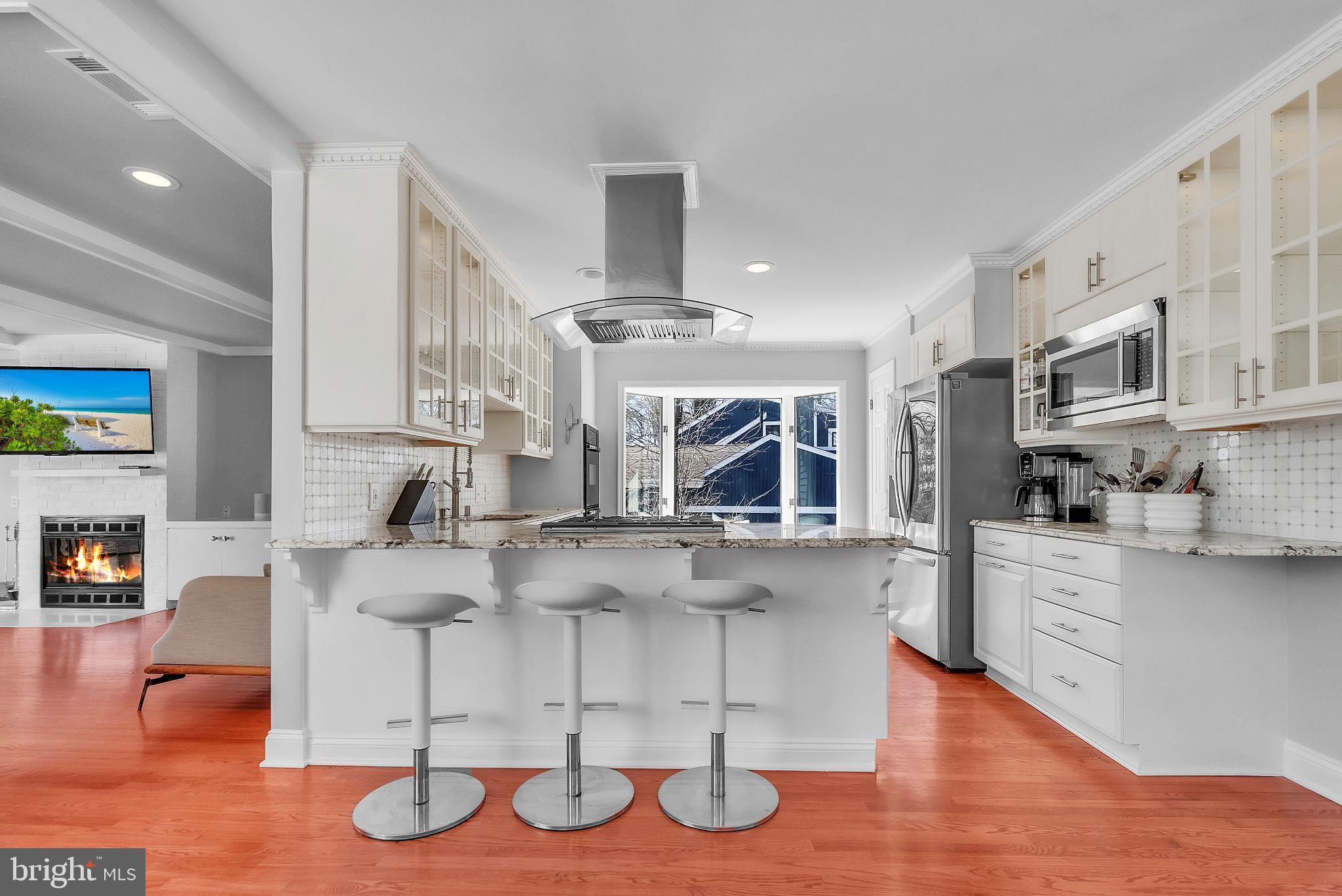 14933 Wellwood Road Silver Spring, MD 20905 - Photo 10 of 50 Modern kitchen with sleek design and light.