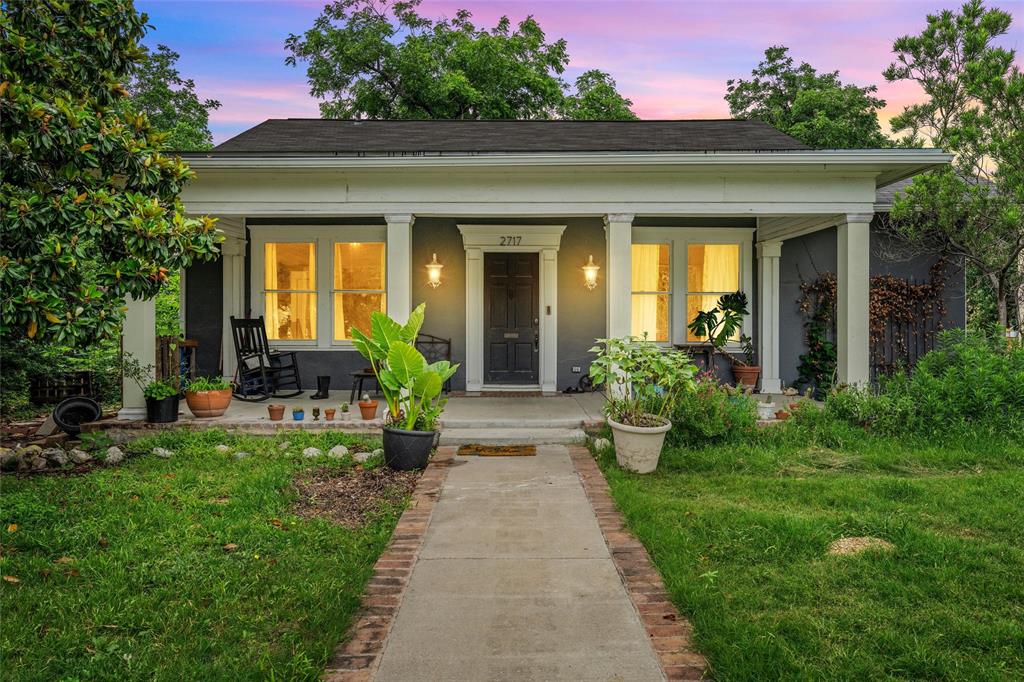 a view of a house with garden and plants