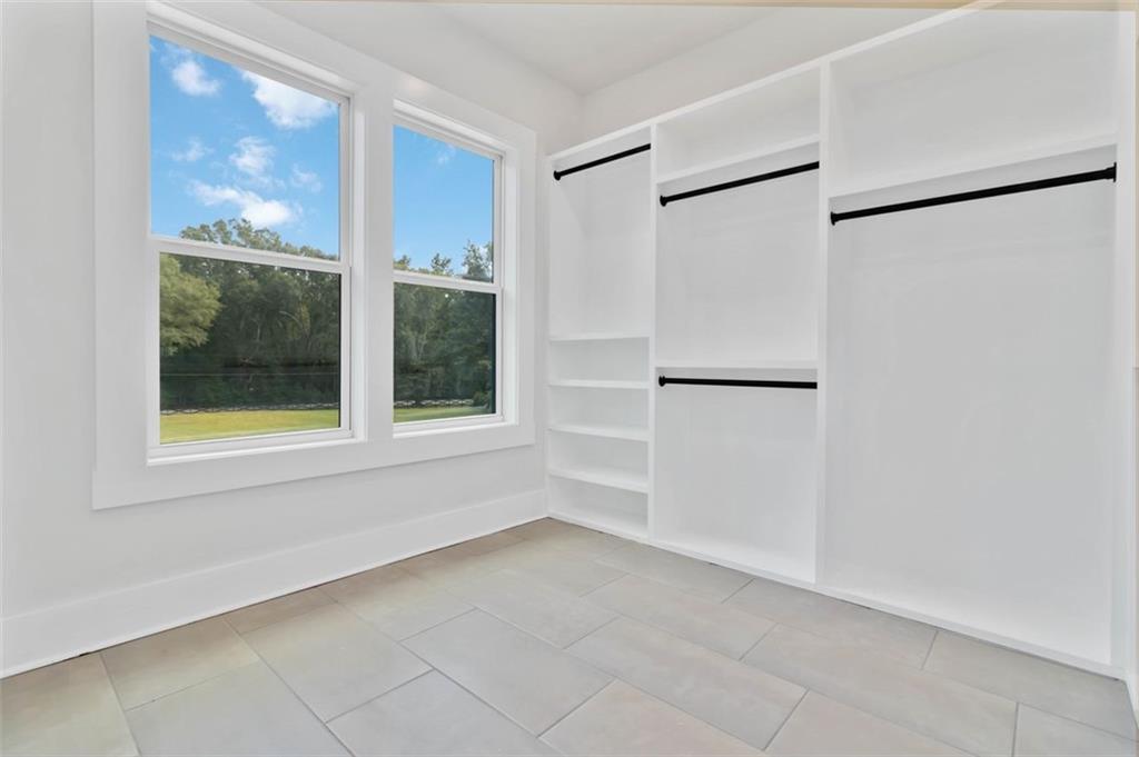 1604 Greendale Road Covington, GA 30014 - Photo 20 of 23 a view of an empty room with a window and a shower