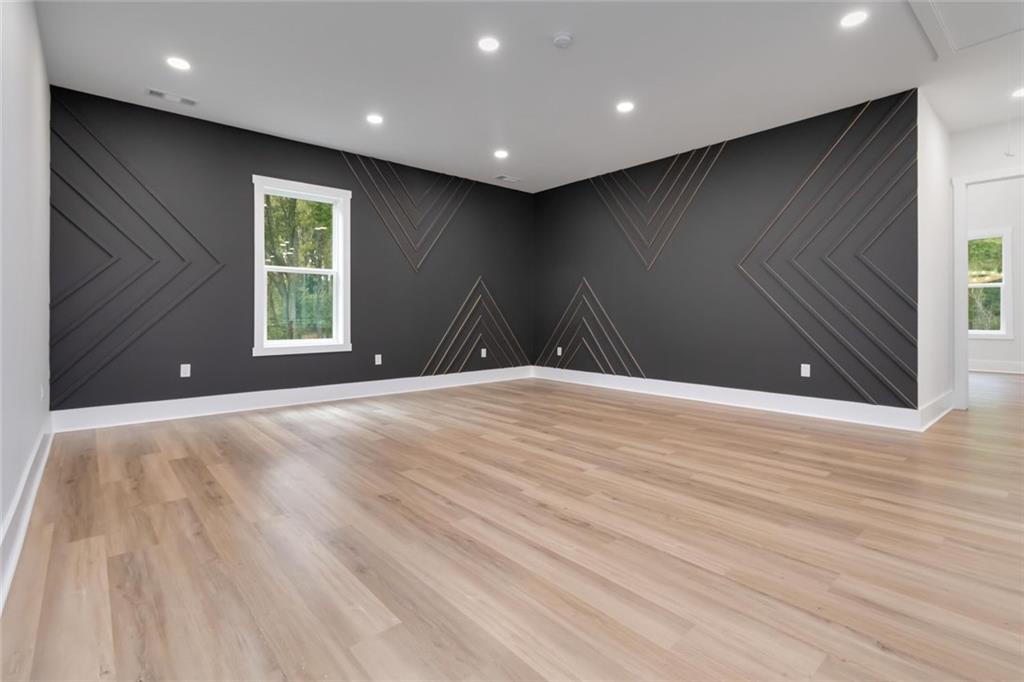 1604 Greendale Road Covington, GA 30014 - Photo 46 of 68 a view of an empty room with wooden floor and a window