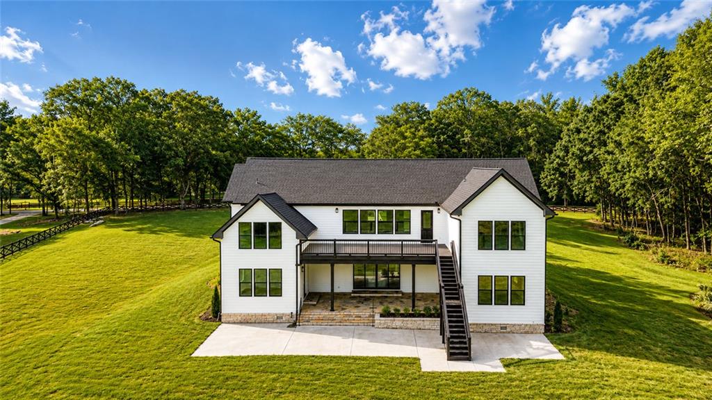 1604 Greendale Road Covington, GA 30014 - Photo 10 of 68 a front view of a house with swimming pool yard and outdoor seating