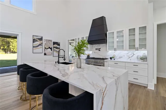 a dining room with furniture and wooden floor