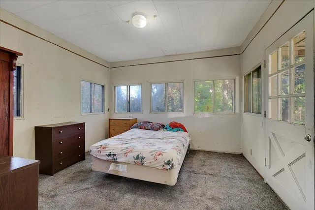 a bathroom with a sink a mirror and a shower