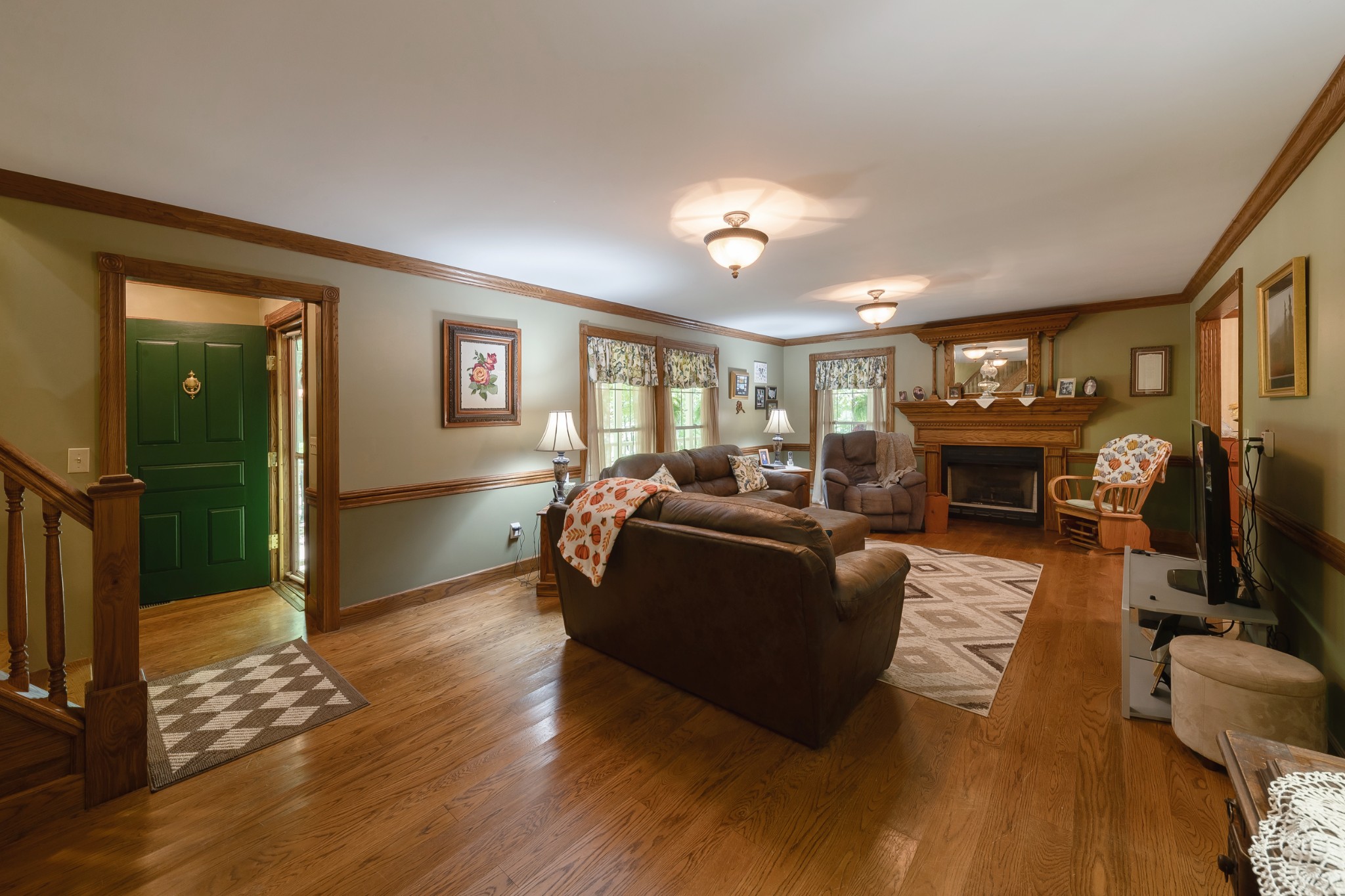 634 Murrell Road Dickson, TN 37055 - Photo 16 of 46 a living room with furniture a fireplace and a flat screen tv