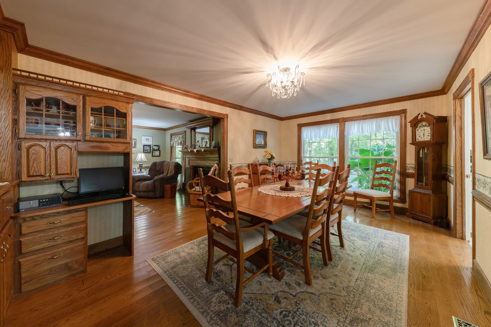 634 Murrell Road Dickson, TN 37055 - Photo 22 of 46 a dining room with wooden floor a chandelier a wooden table and chairs