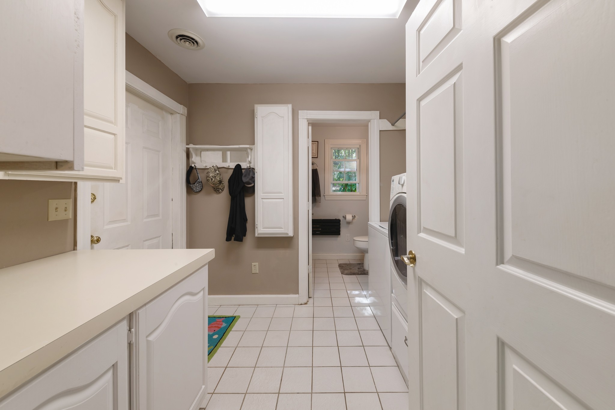 634 Murrell Road Dickson, TN 37055 - Photo 23 of 46 a hallway with a white stove top oven and a refrigerator