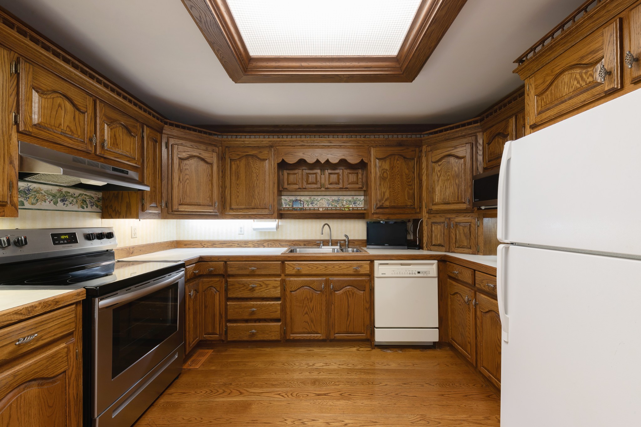 634 Murrell Road Dickson, TN 37055 - Photo 26 of 46 a kitchen with a stove a sink and a refrigerator
