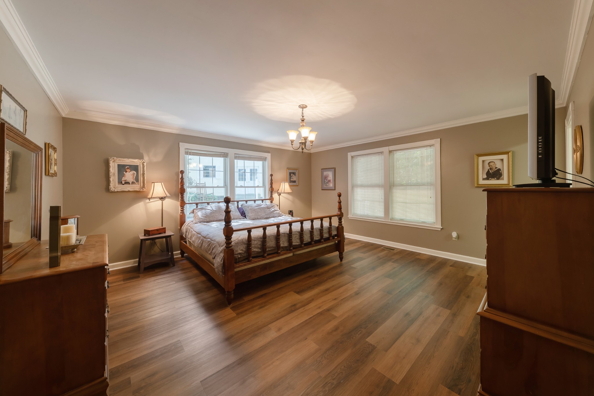 634 Murrell Road Dickson, TN 37055 - Photo 28 of 46 a bedroom with a bed window and a flat screen tv