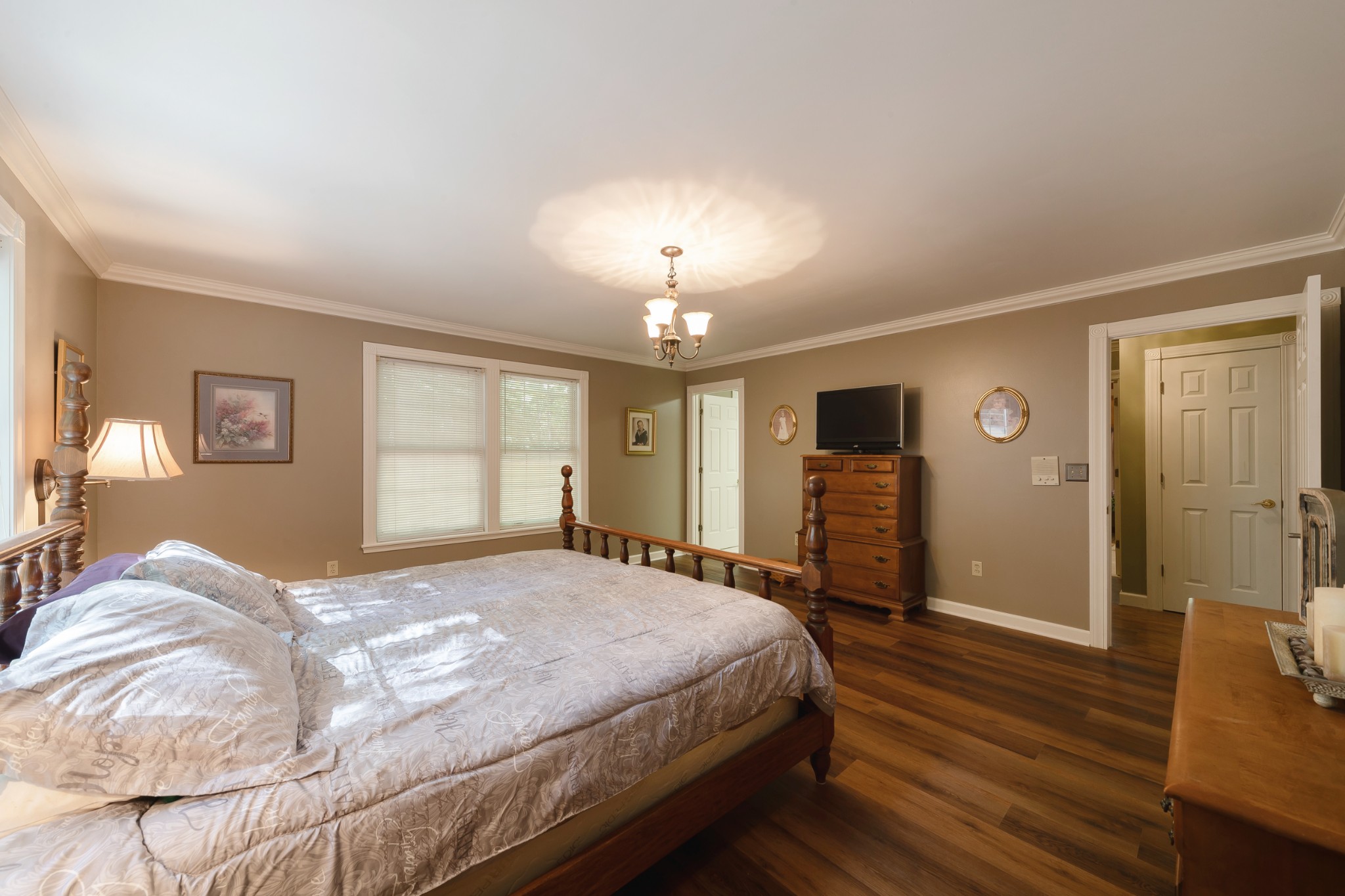 634 Murrell Road Dickson, TN 37055 - Photo 29 of 46 a bedroom with a bed and wooden floor