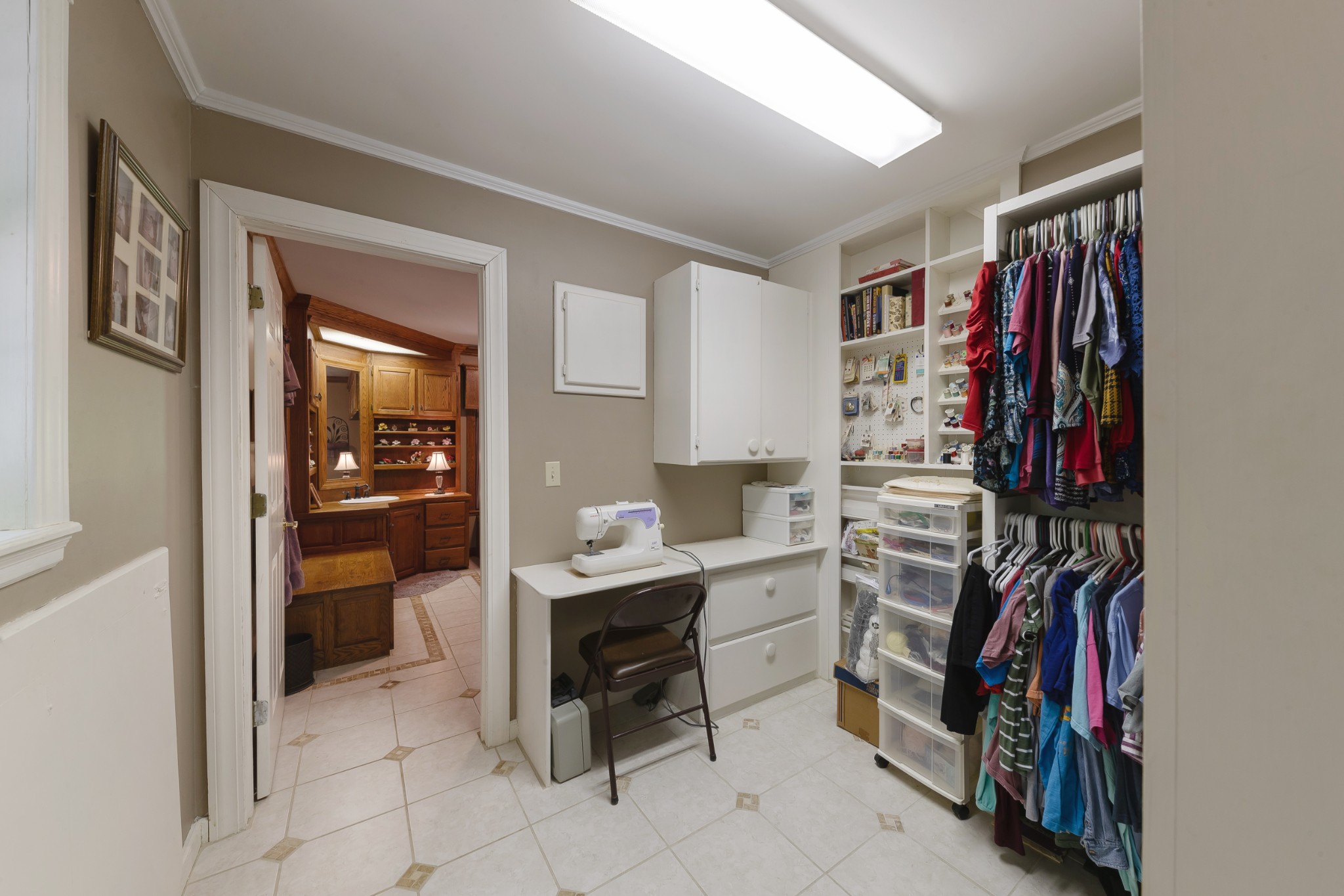 634 Murrell Road Dickson, TN 37055 - Photo 30 of 46 a view of walk in closet with clothes and shoes