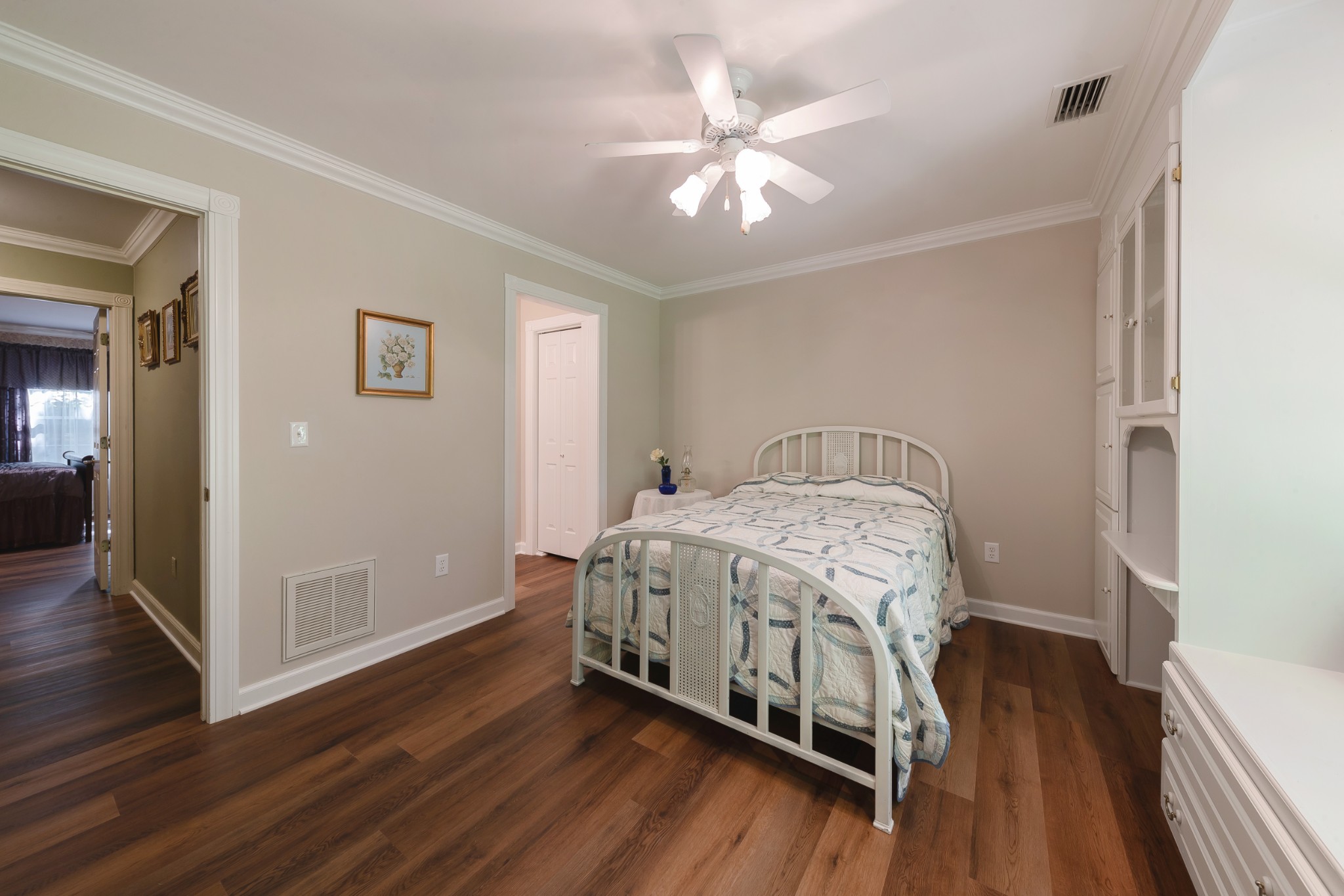 634 Murrell Road Dickson, TN 37055 - Photo 34 of 46 a bedroom with a bed and wooden floor