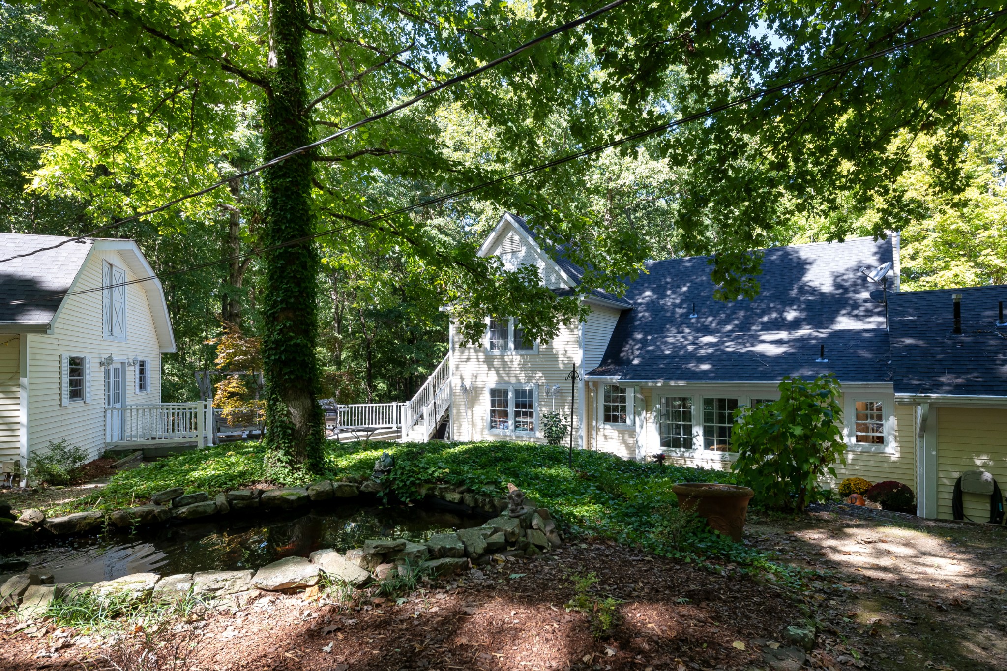 634 Murrell Road Dickson, TN 37055 - Photo 46 of 46 a front view of a house with a yard and potted plants