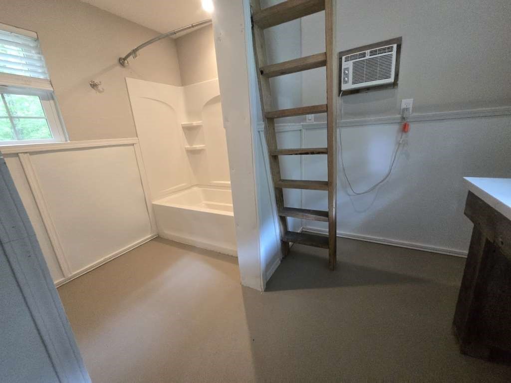 667 Miller Drive Cleveland, TX 77327 - Photo 4 of 25 a view of an empty room with a window