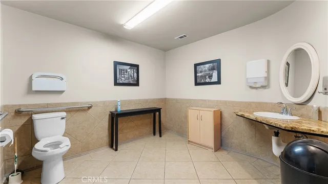 a bedroom with a bed and a desk