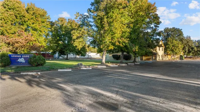 a view of a street with a building in the background