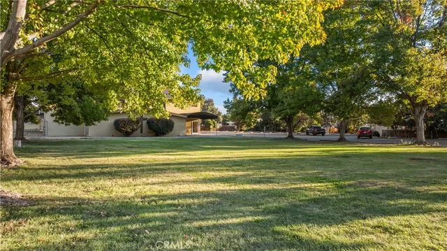 a view of a big house with a big yard
