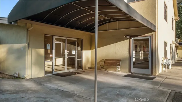 a view of a house with a door and wooden floor