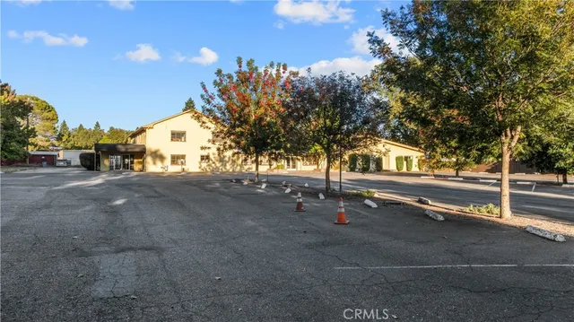 a view of backyard with barbeque grill and outdoor seating