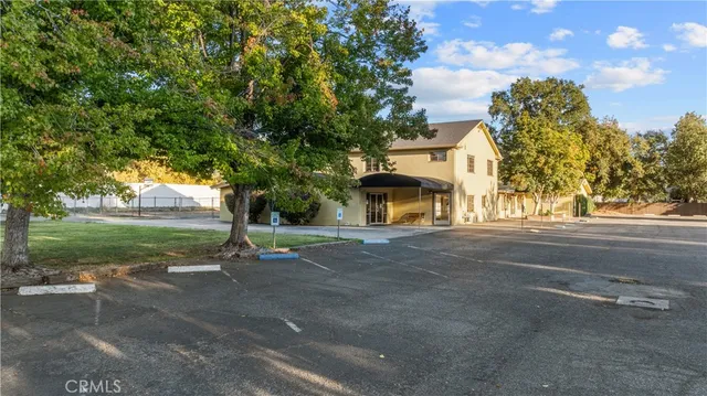 a view of a street with a building in the background