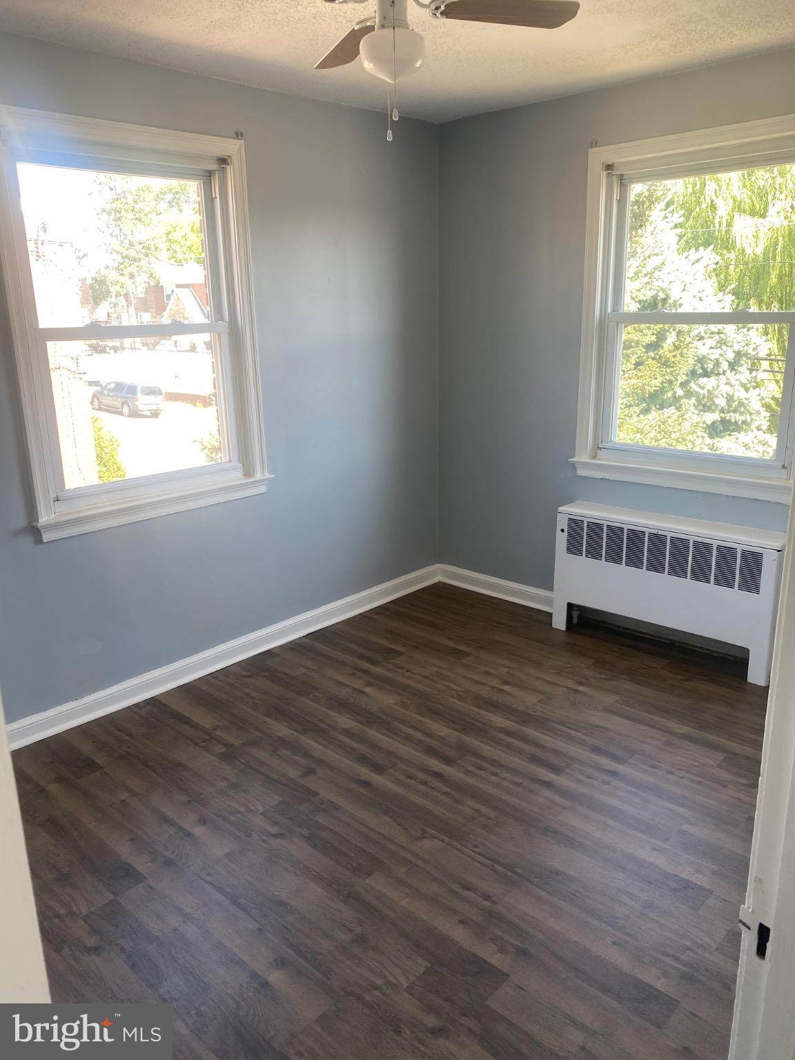 6254 Everett Street, Unit 3 Philadelphia, PA 19149 - Photo 7 of 8 a view of an empty room with wooden floor and a window