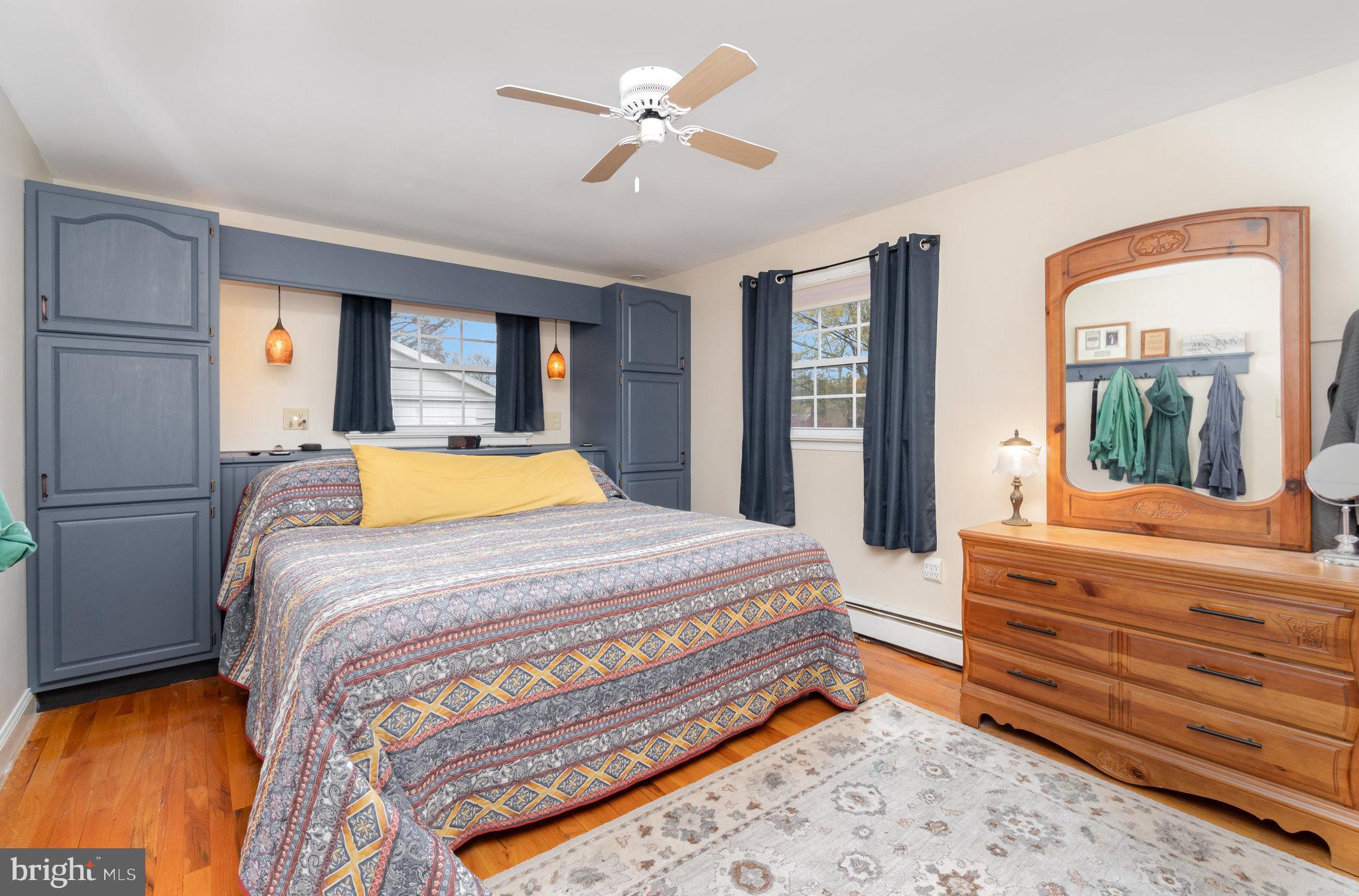 430 Orchard Road Mount Joy, PA 17552 - Photo 18 of 41 a bedroom with a large bed and a chandelier