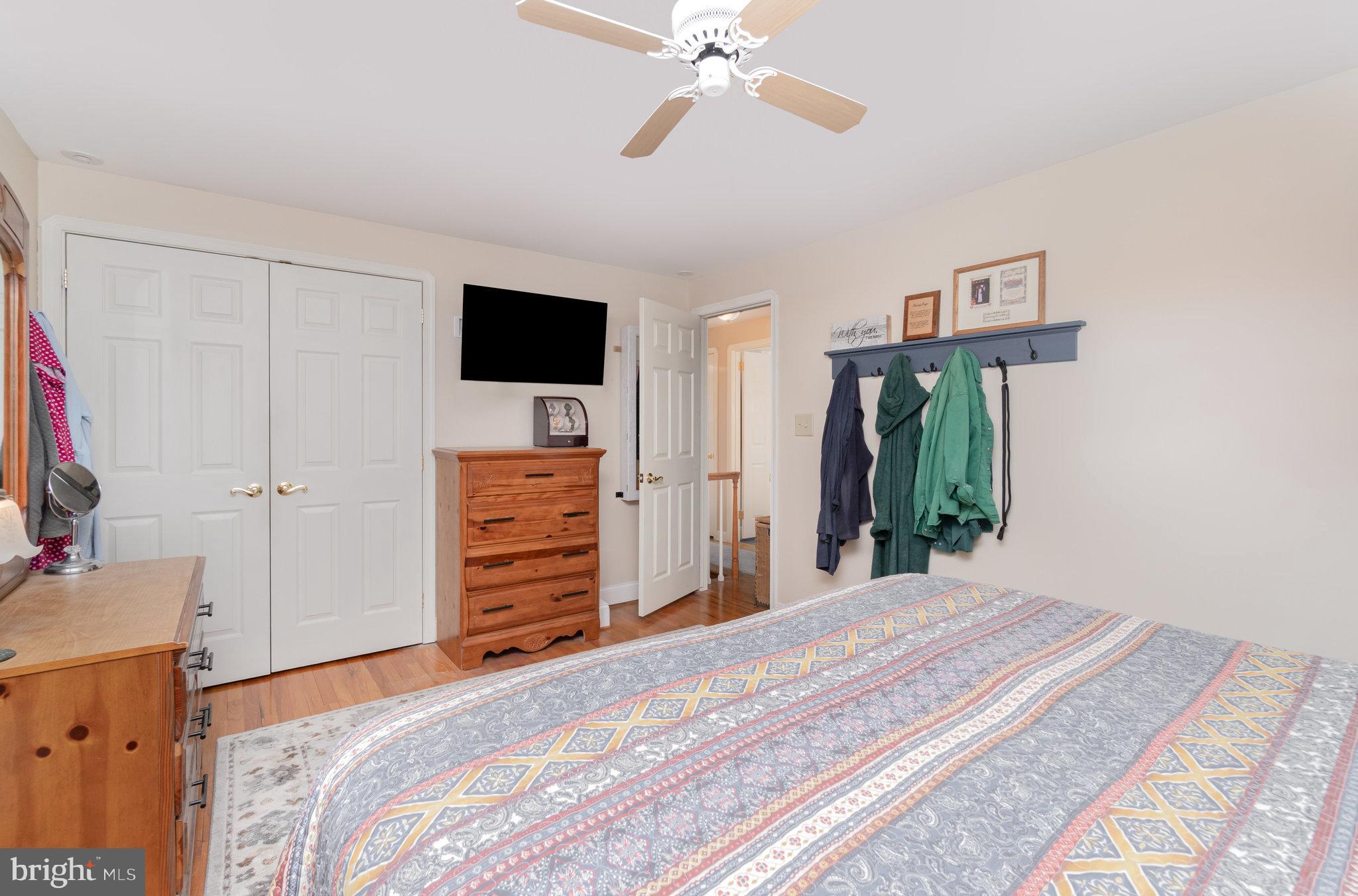 430 Orchard Road Mount Joy, PA 17552 - Photo 19 of 41 a bedroom with a bed and a flat tv screen on dresser