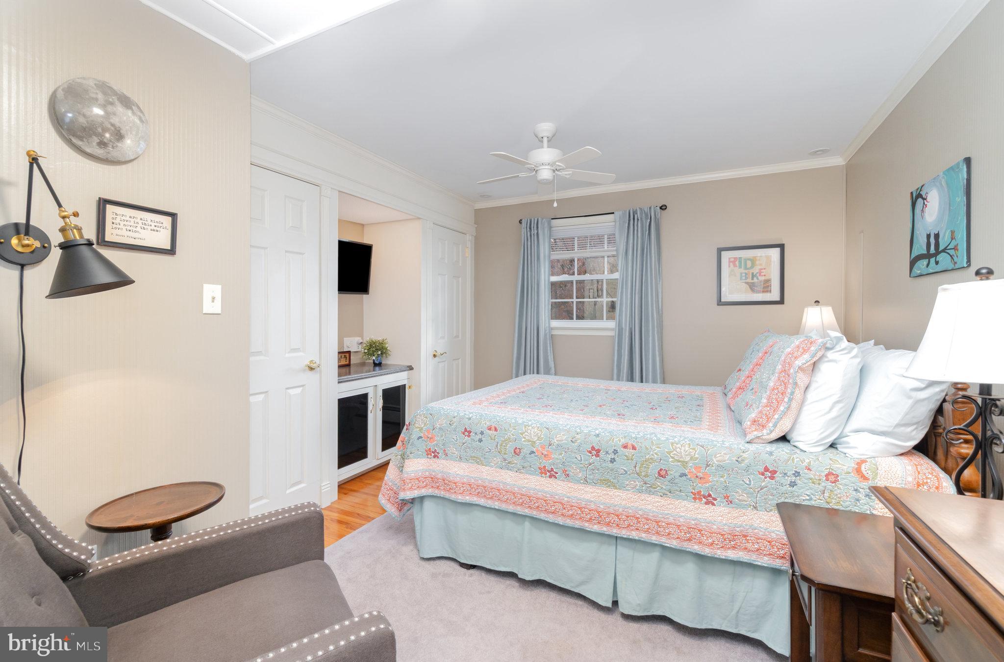 430 Orchard Road Mount Joy, PA 17552 - Photo 22 of 41 a bedroom with a bed and a chandelier