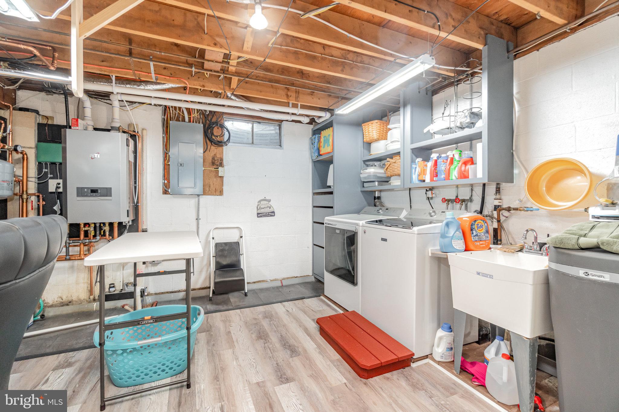 430 Orchard Road Mount Joy, PA 17552 - Photo 29 of 41 a utility room with cabinets dryer and washer