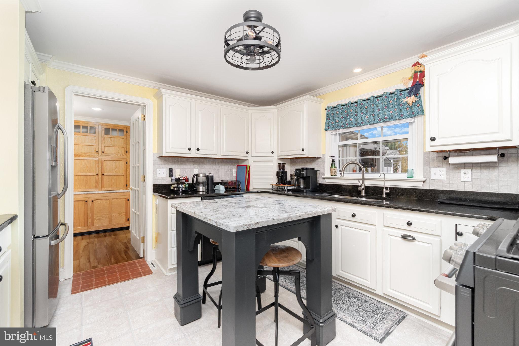 430 Orchard Road Mount Joy, PA 17552 - Photo 9 of 41 a kitchen with granite countertop a sink appliances a counter space and a window
