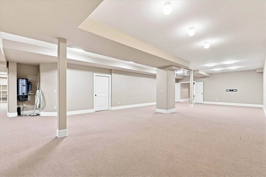 181 Sentell Road Williamston, SC 29697 - Photo 35 of 46 A spacious carpeted basement provides a versatile open layout with clean white trim.