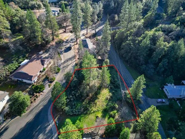 an aerial view of house with yard