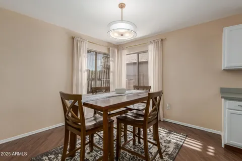 a view of a dining room with furniture and window