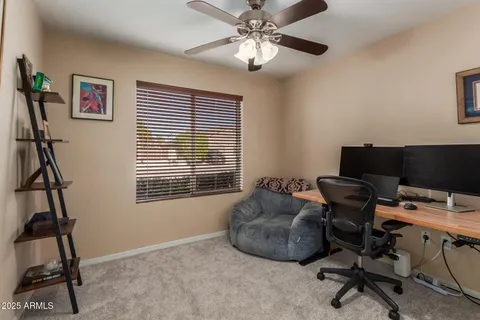 a workspace with furniture and a window