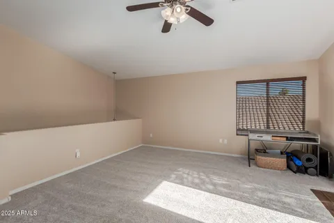 a view of livingroom with furniture and ceiling fan