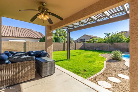 a patio with yard table and chairs