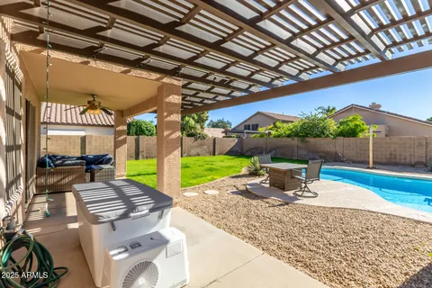 a view of a backyard with sitting area