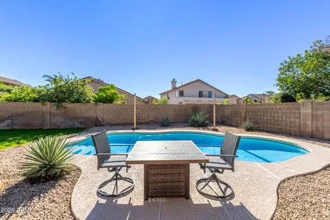 a view of an outdoor sitting area with furniture
