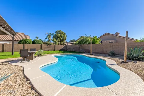 a view of a swimming pool with a patio