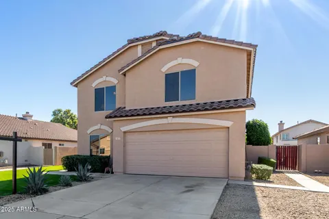 a front view of a house with garage