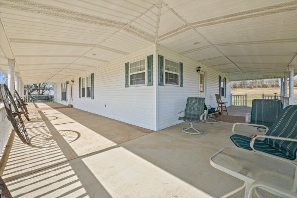 3261 Bell Road Watertown, TN 37184 - Photo 2 of 3 a view of a patio with couches chairs and potted plants