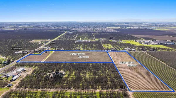 an aerial view of a tennis ground and a buildings
