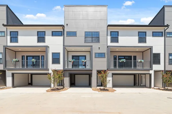 a front view of a house with a outdoor space