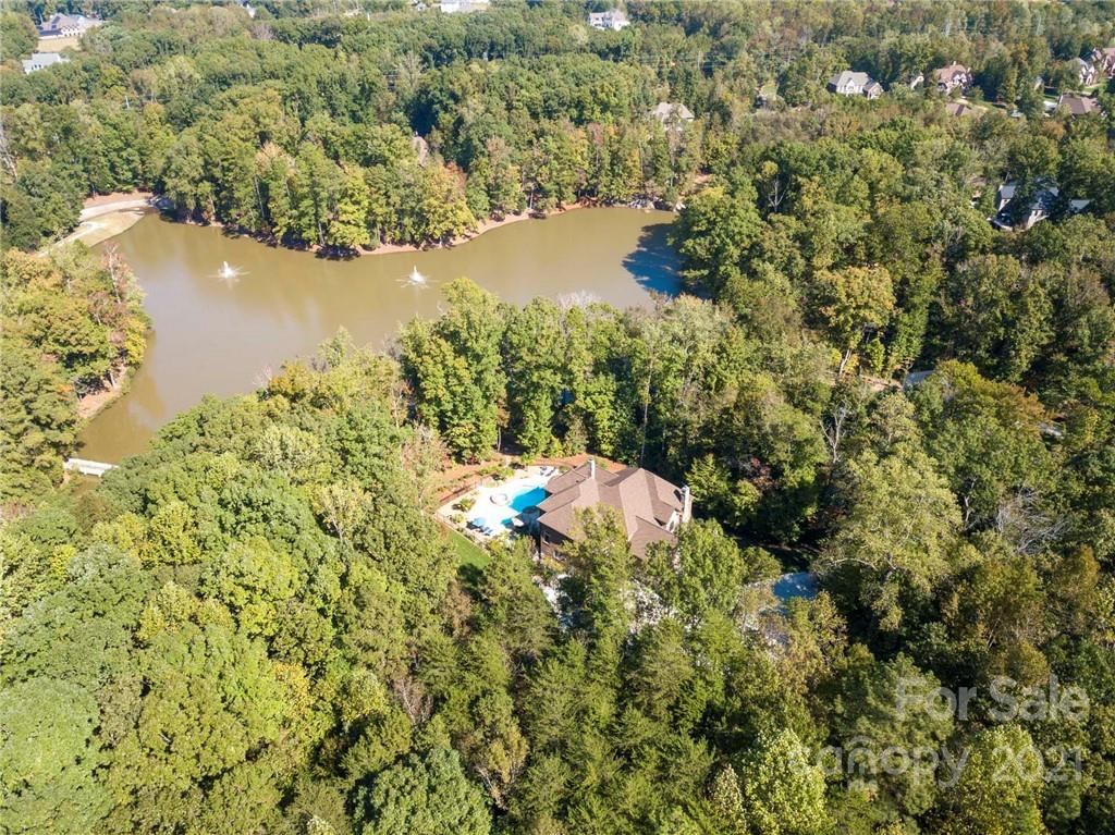 2130 Pondmeade Lane Matthews, NC 28104 - Photo 13 of 47 a view of a lake from a yard