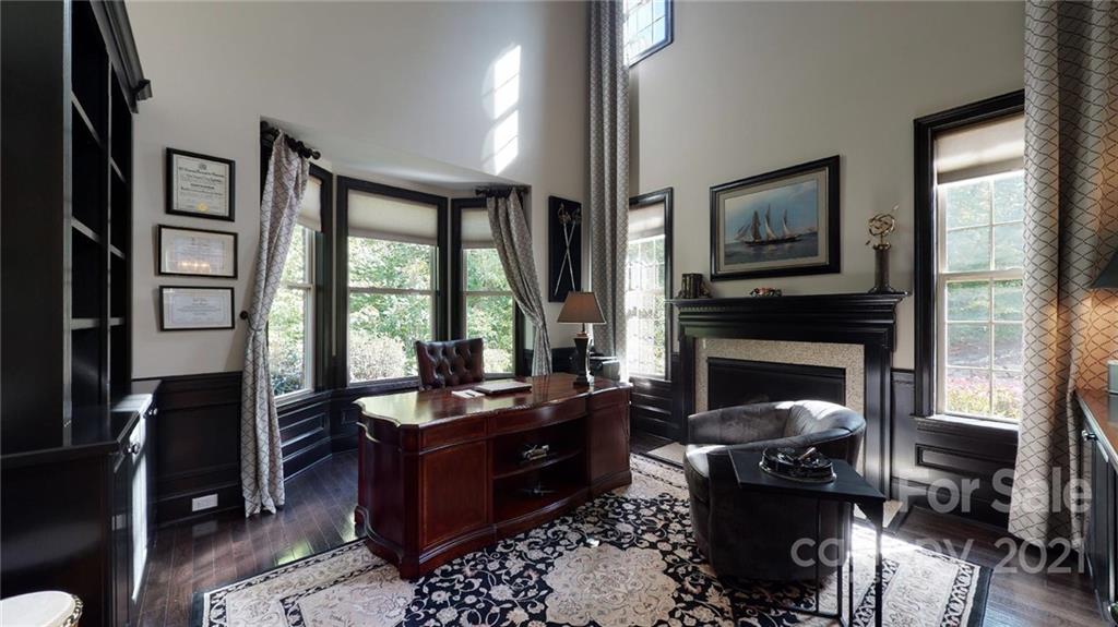 2130 Pondmeade Lane Matthews, NC 28104 - Photo 20 of 47 a living room with furniture a window and a fireplace